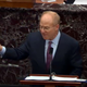 In this screenshot taken from a congress.gov webcast, David Schoen, defense lawyer for former President Donald Trump speaks while holding a copy of the Constitution on the first day of former President Donald Trump’s second impeachment trial at the U.S. Capitol on February 9, 2021 in Washington, DC.